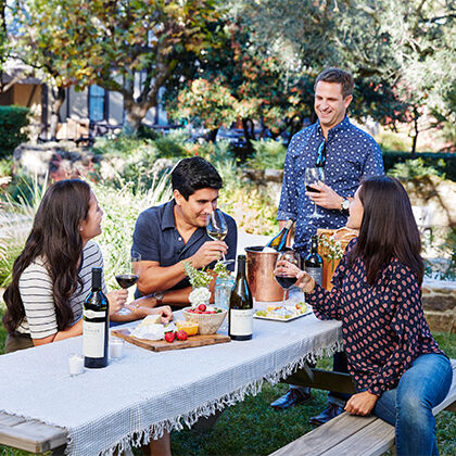 People sitting and enjoying wine